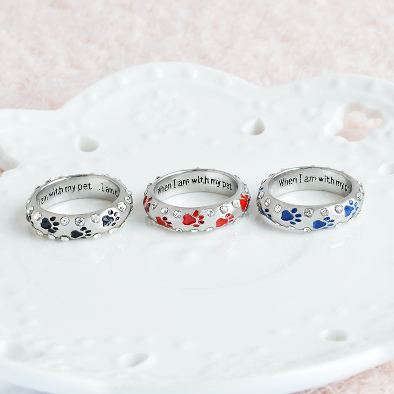 Anillo Sentimiento Canino con Huellas y Cristales